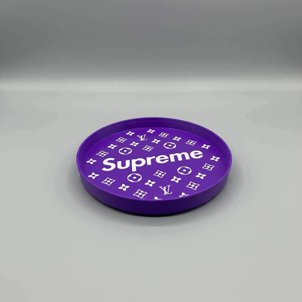 Purple plate with white patterns and 'Supreme' text on a gray surface