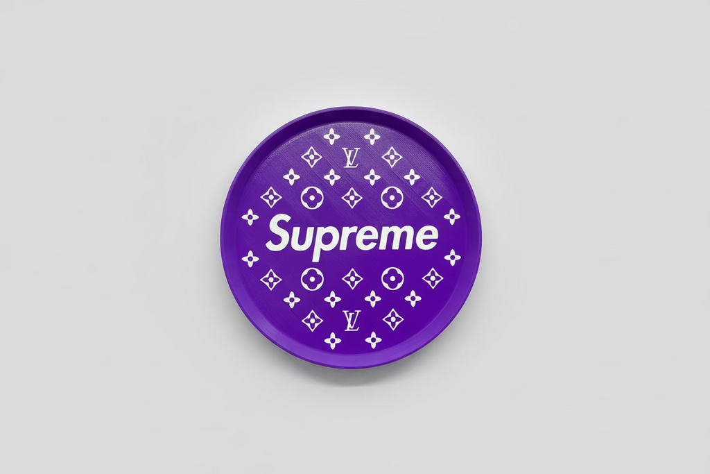 Purple plate with 'Supreme' text and Louis Vuitton logos on a dark surface