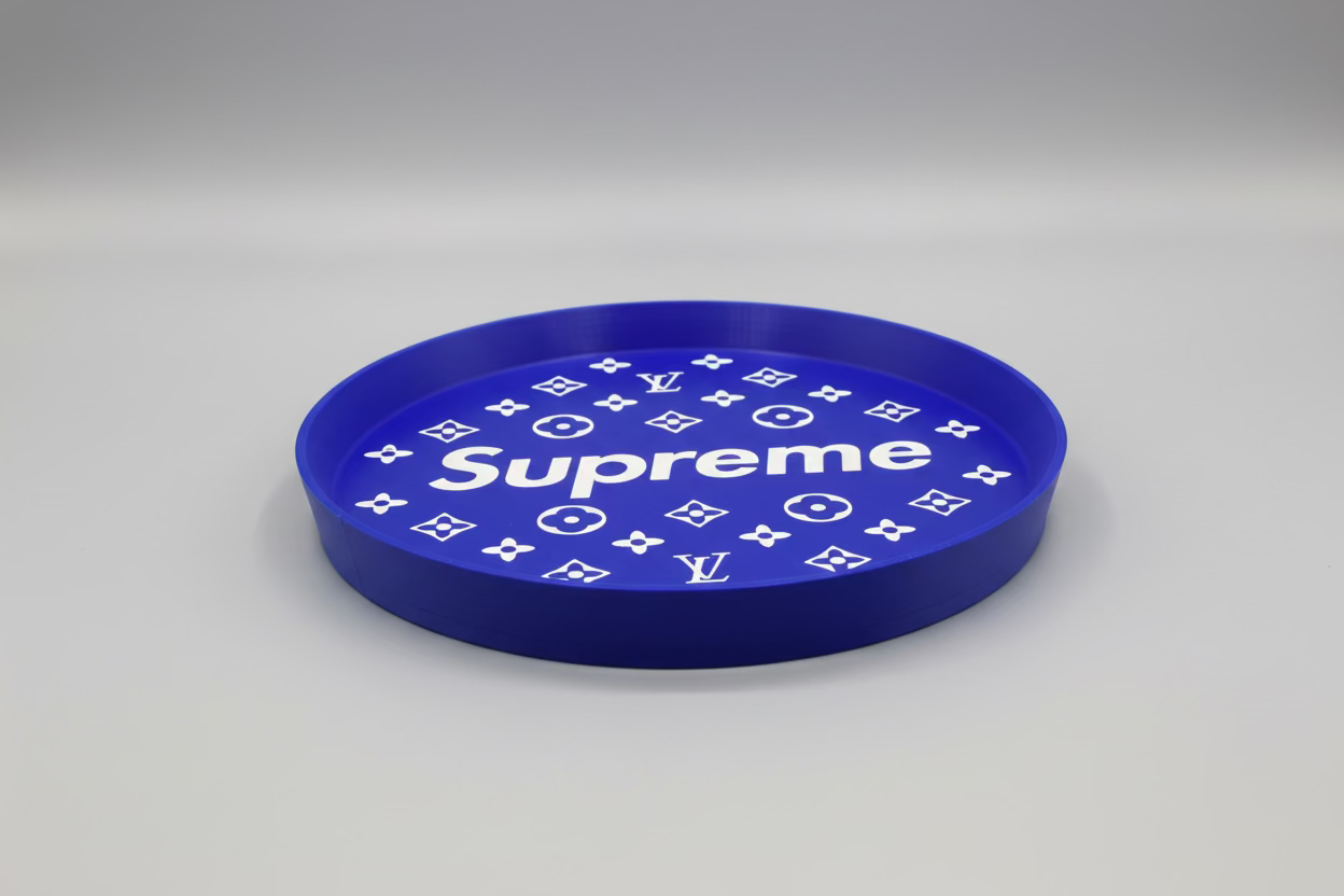 Blue circular object with 'Supreme' and Louis Vuitton logos on a dark background