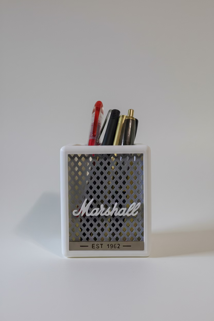 Marshall speaker-style pen holder with pens on a white surface