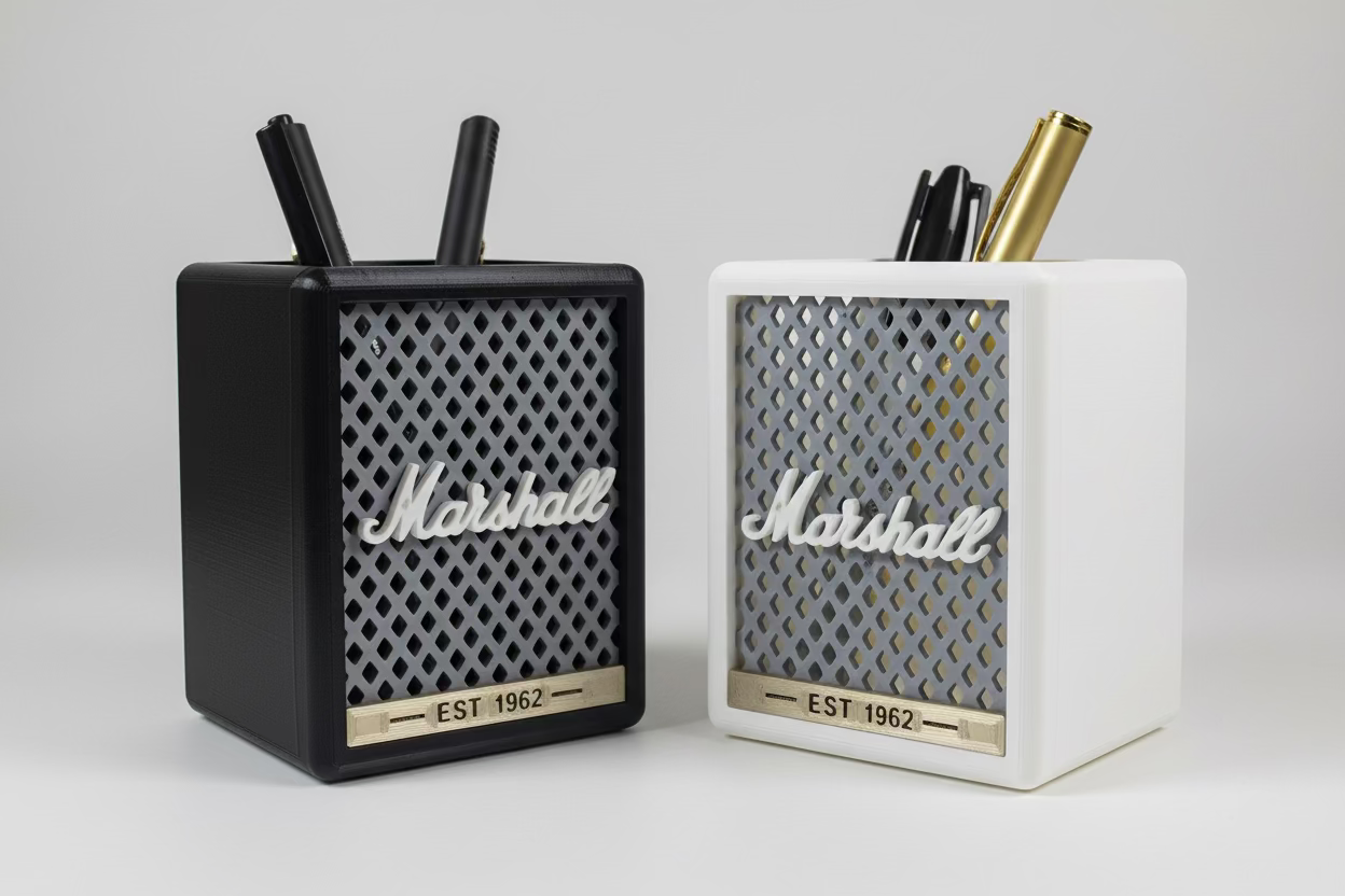 Two Marshall-branded pen holders with pens on a white surface.