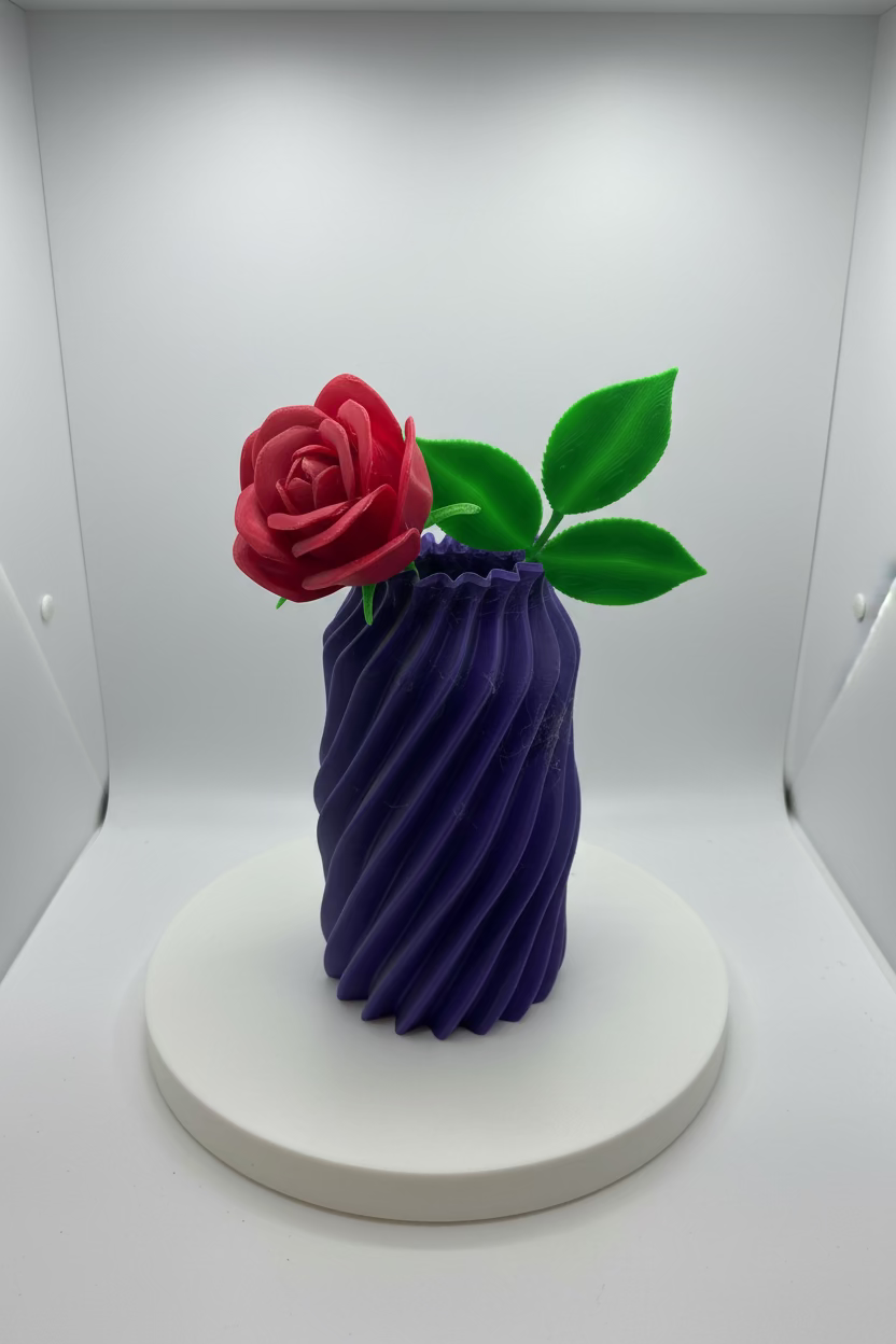 3D-printed flower and vase on a white surface