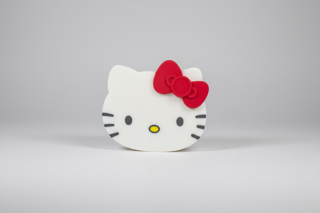 Hello Kitty face design on a black surface