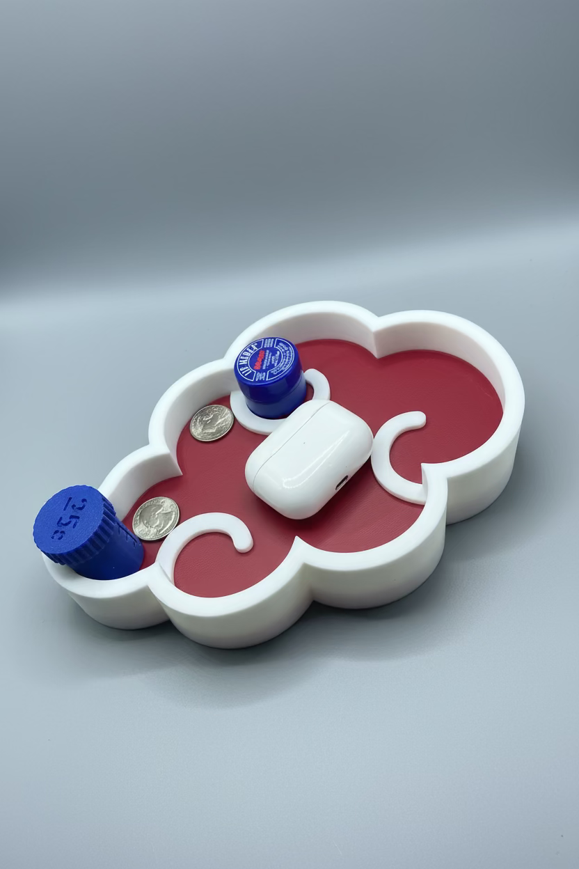 Red and white heart-shaped container with blue lids on a gray surface
