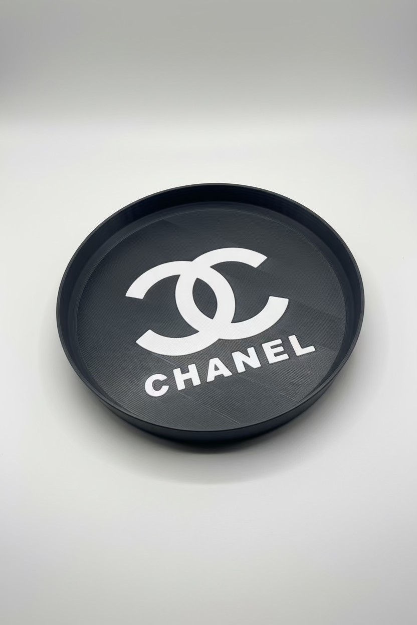 Chanel logo on a round metallic object